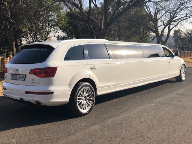 Spacious and luxurious 12-seater Audi Q7 limousine with leather seats and ambient lighting, ideal for group outings in Pretoria.