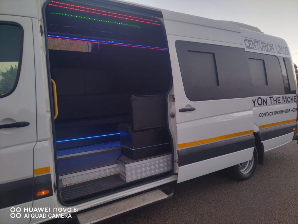 A vibrant 18-seater party bus with neon lights and a spacious interior, ideal for birthdays and group celebrations in Gauteng.