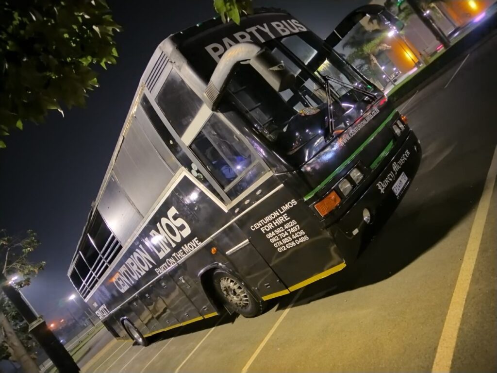 A vibrant 40-seater open-top party bus filled with people celebrating and enjoying the city views in Gauteng.