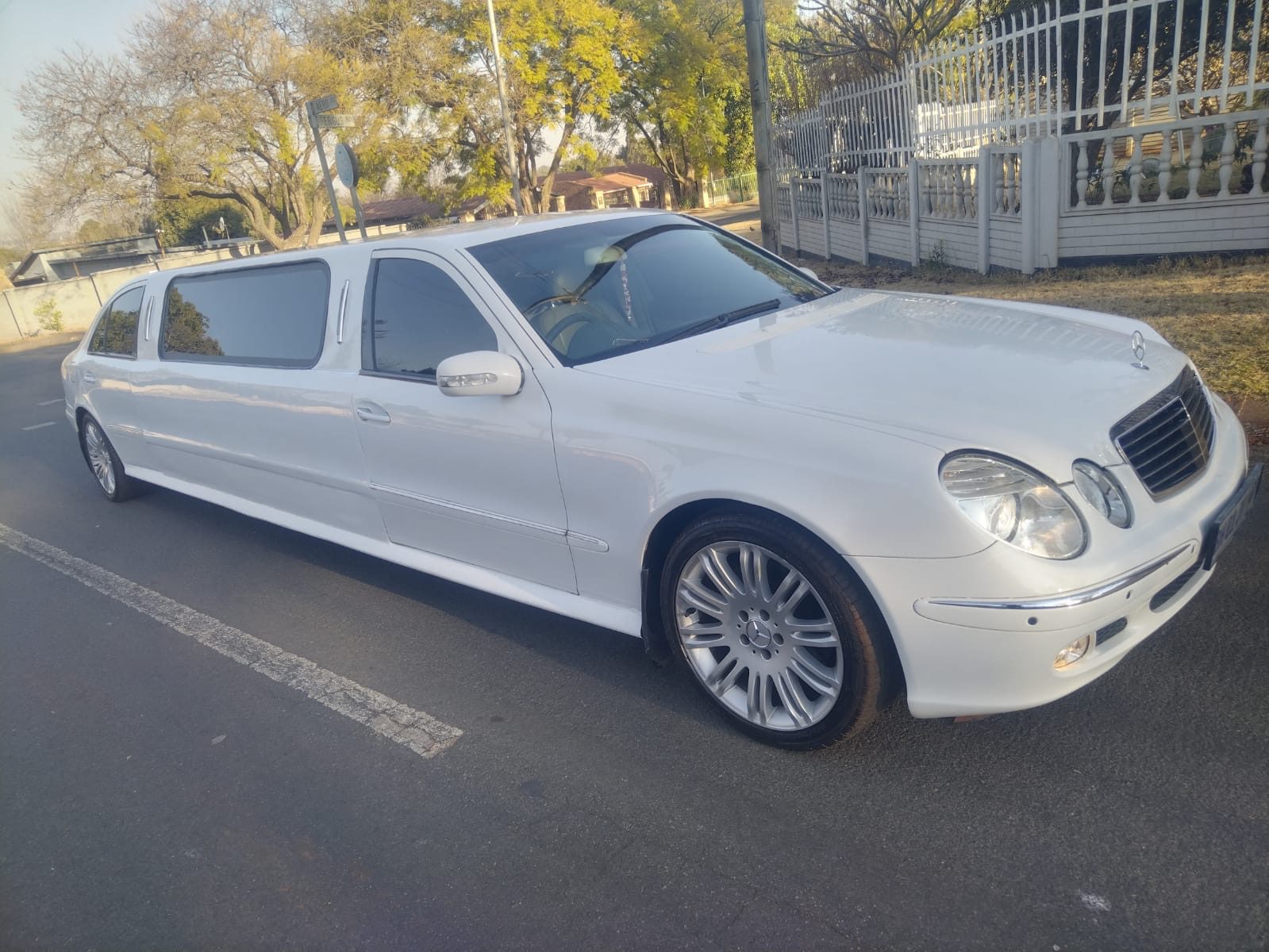 White Mercedes-Benz E-Class stretch limousine
