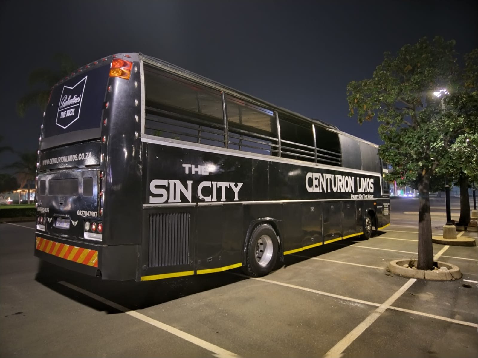 Centurion Limos 40-seater open-top party bus parked at night in Pretoria